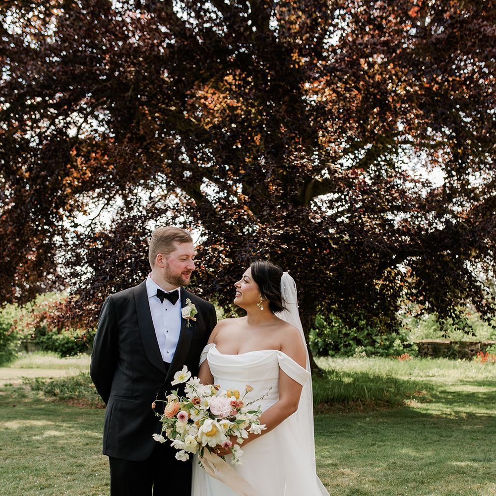 bride-gazes-up-at-groom-in-couple-portrait