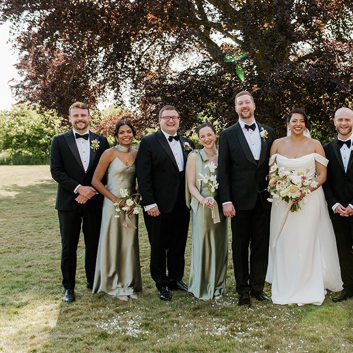wedding-party-in-black-tie-and-green-satin-dresses