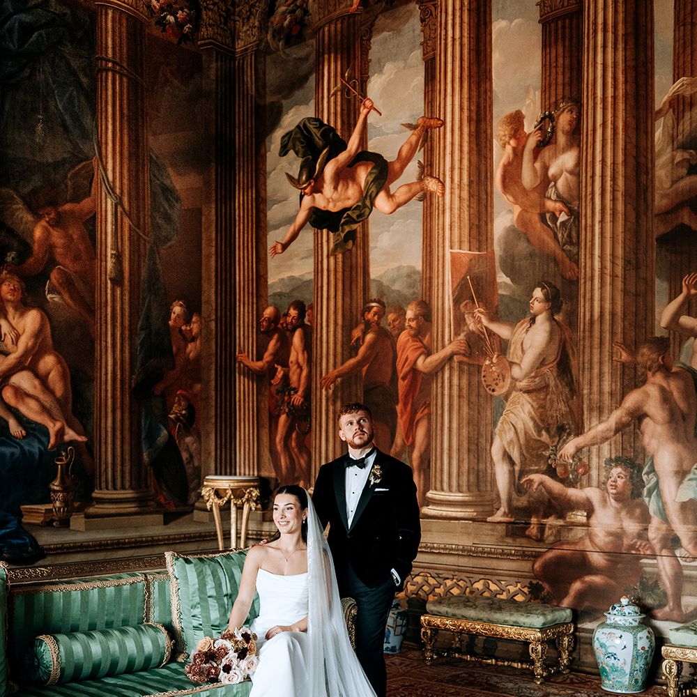 bride-wears-wedding-veil-with-train-and-groom-in-black-tux