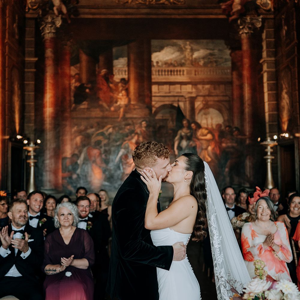 first-kiss-for-bride-and-groom-at-burghley-house