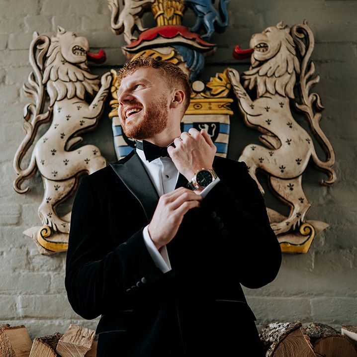 groom-gets-ready-for-wedding-in-black-tuxedo