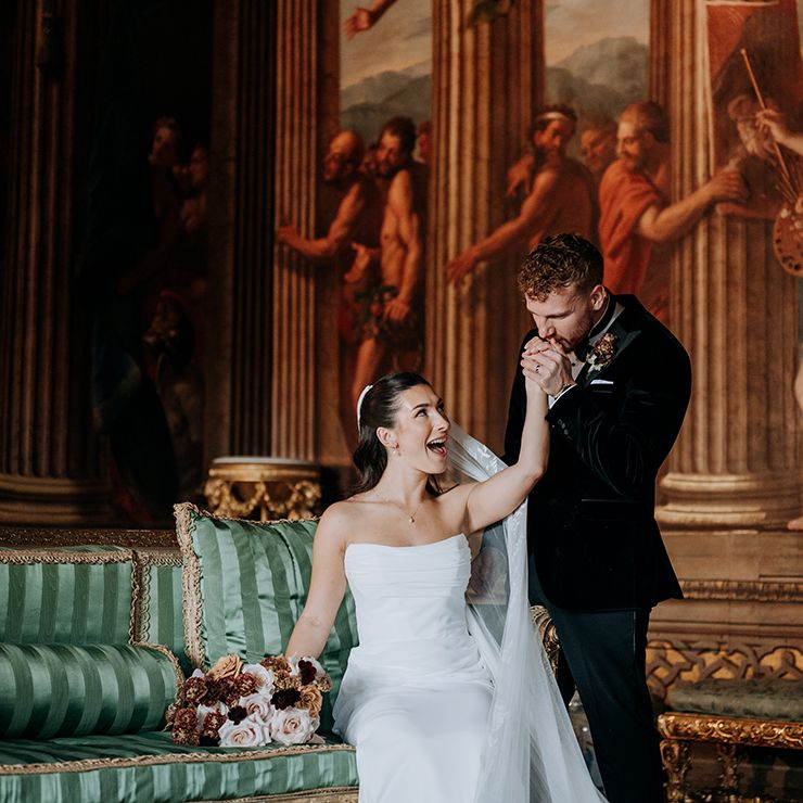 groom-kisses-brides-hand-on-wedding-day