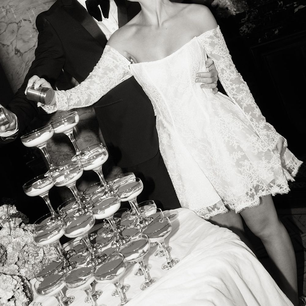 Couple shakes chocolate over tiramisu tower 