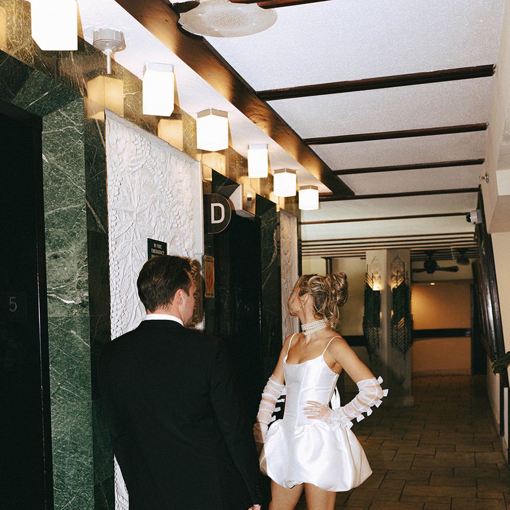bride-and-groom-waiting-for-lift-at-hotel
