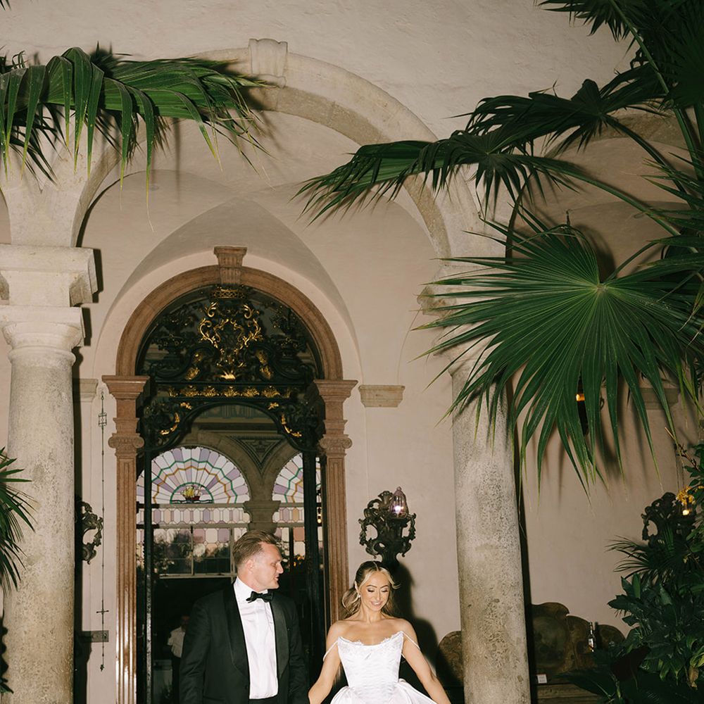 bride-in-lingerie-inspired-bespoke-wedding-dress-with-groom-in-black-tux