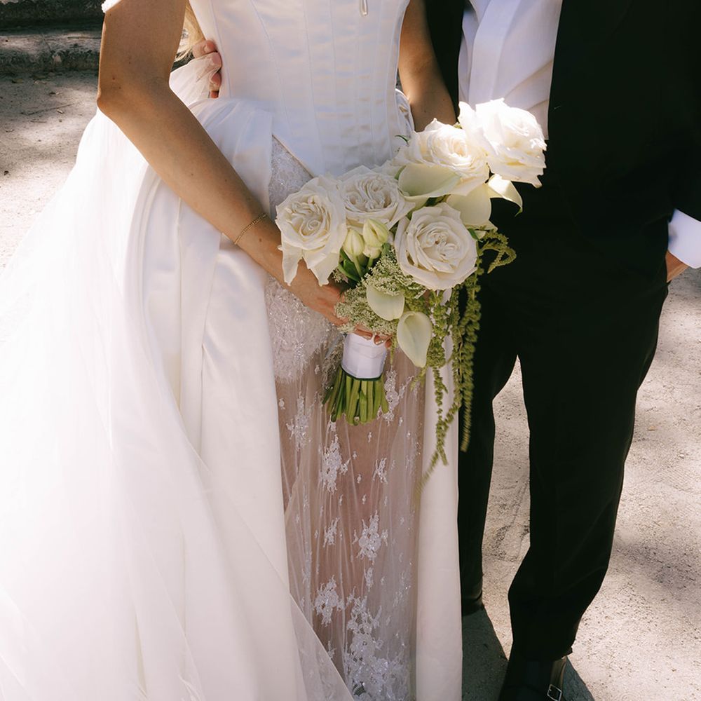 bride-in-vintage-wedding-dress-with-white-wedding-bouquet