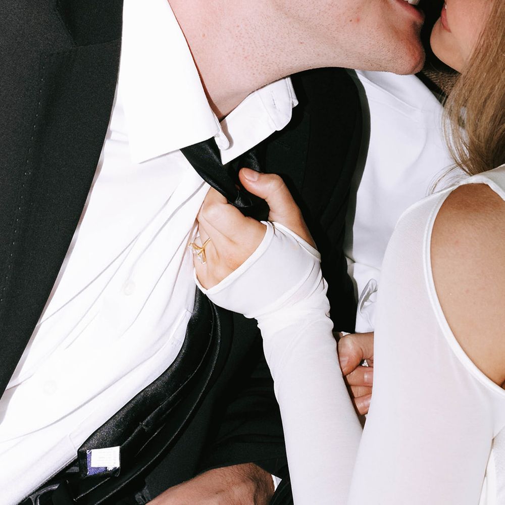 Bride pulls groom in for a kiss 