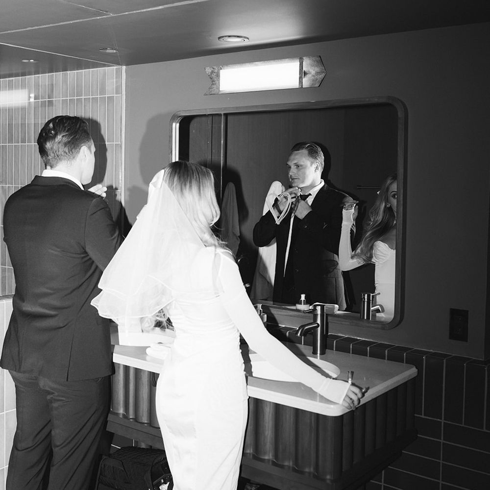 Couple gets ready together for engagement shoot