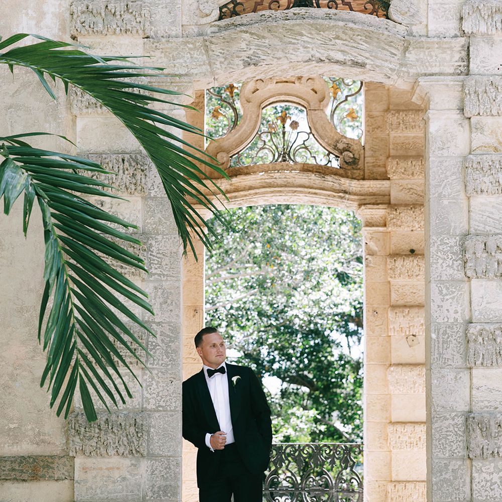 groom-in-black-tuxedo-a-t-vizcaya-museum-and-gardens-wedding