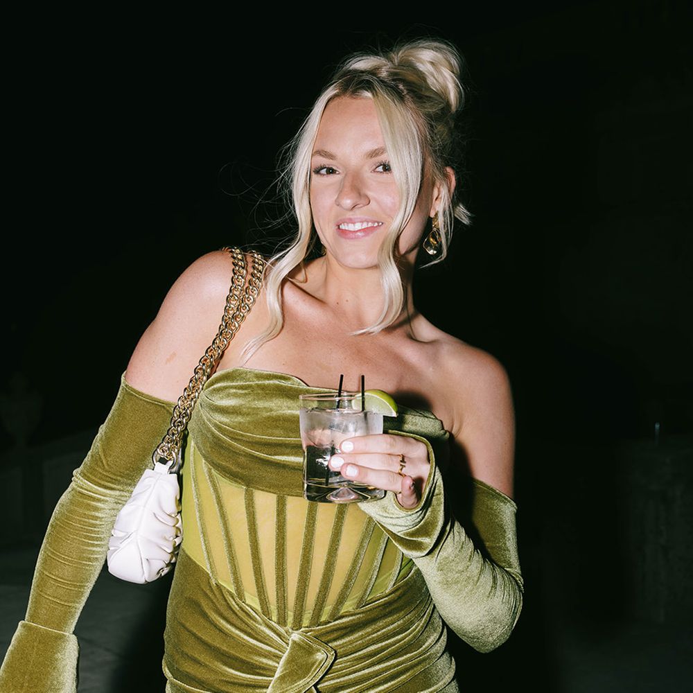 Wedding guest in velvet green dress