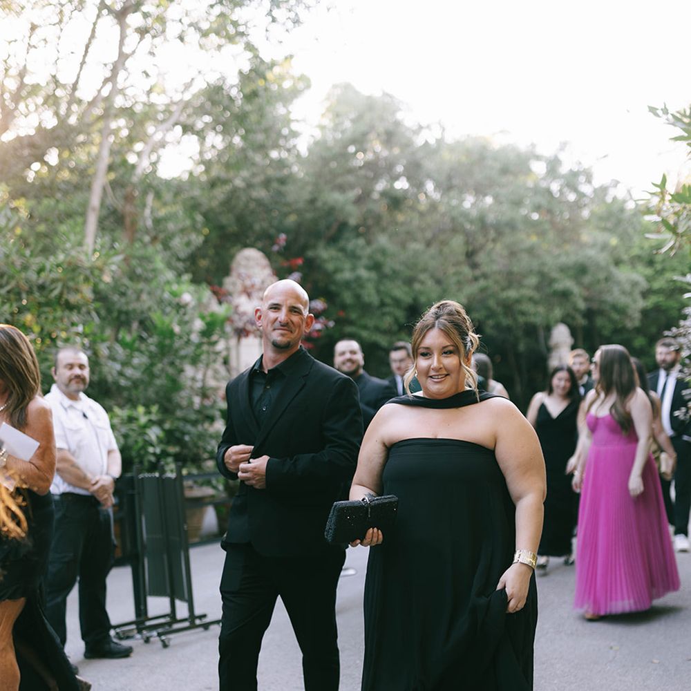 Wedding guests wearing all black outfits 