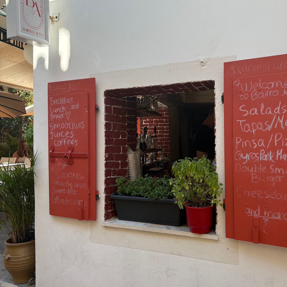 Paxos cafe window with shutters