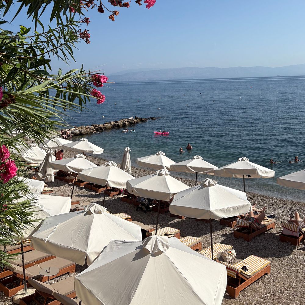 Valmar Corfu hotel private beach with sun loungers