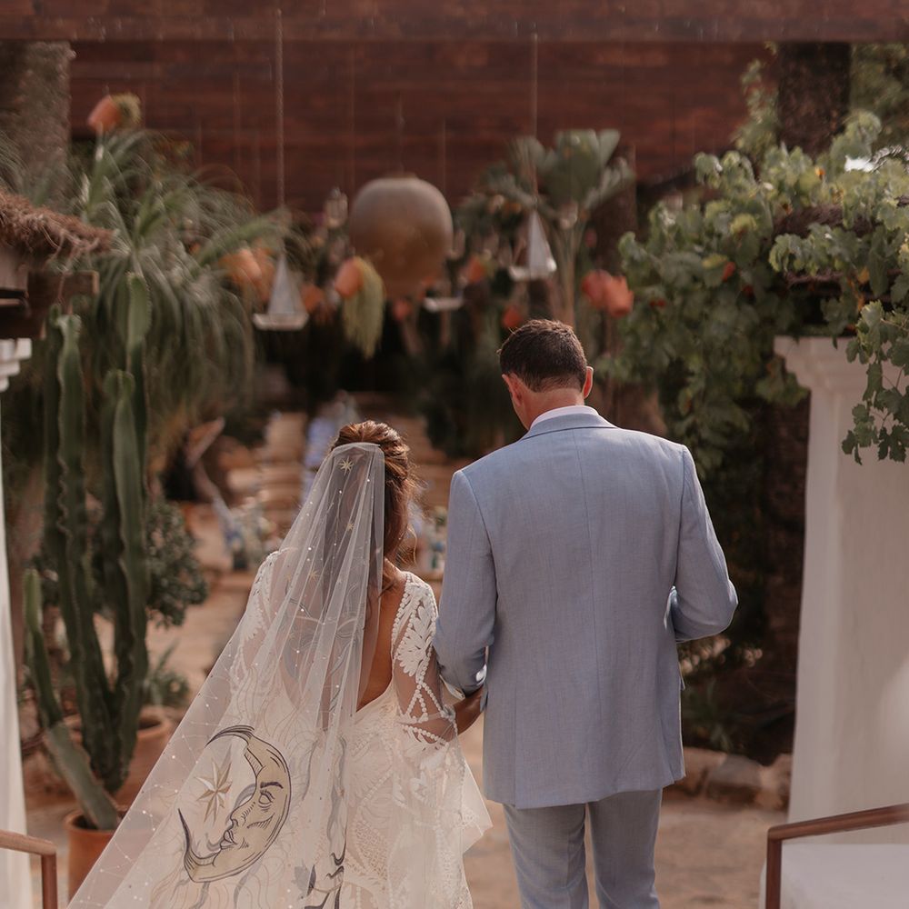 bride-wearing-blue-flower-and-moon-wedding-veil.