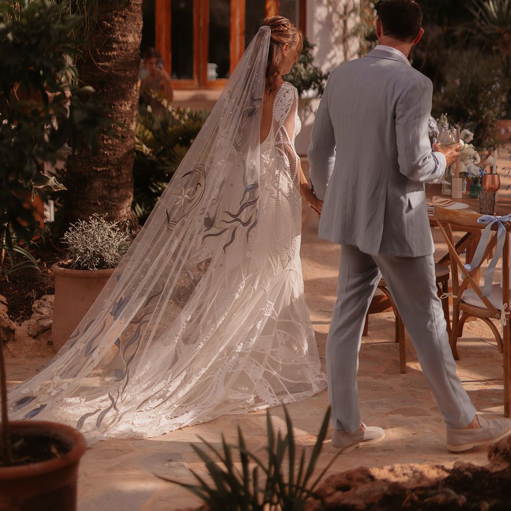 decorative-floral-moon-celestial-wedding-veil-with-groom-in-blue-suit