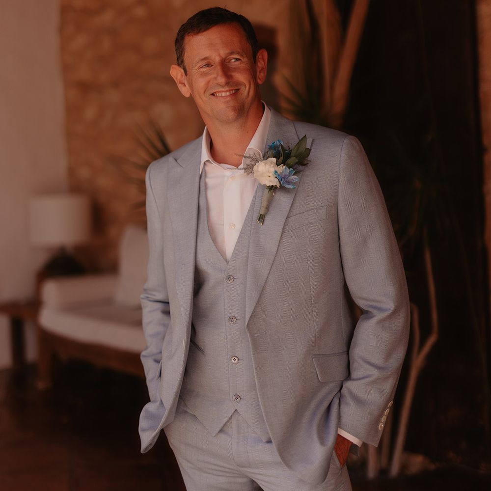 groom-in-three-piece-blue-wedding-suit