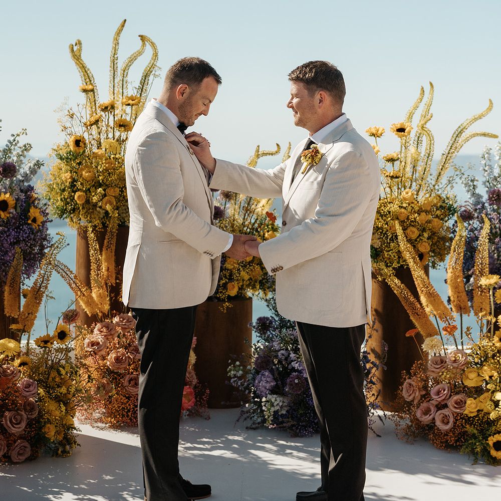 grooms-holding-hands-for-wedding-ceremony