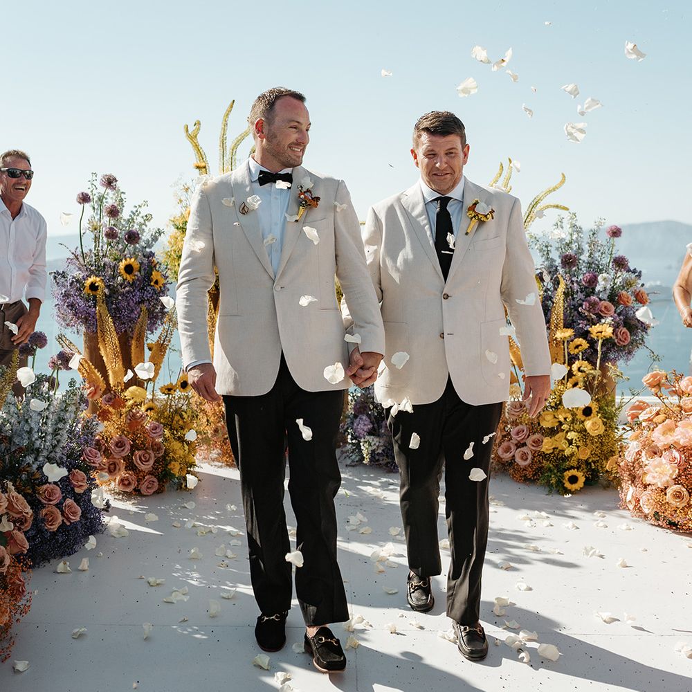 grooms-in-white-wedding-suit-with-black-bow-ties-rose-petal-confetti-moment