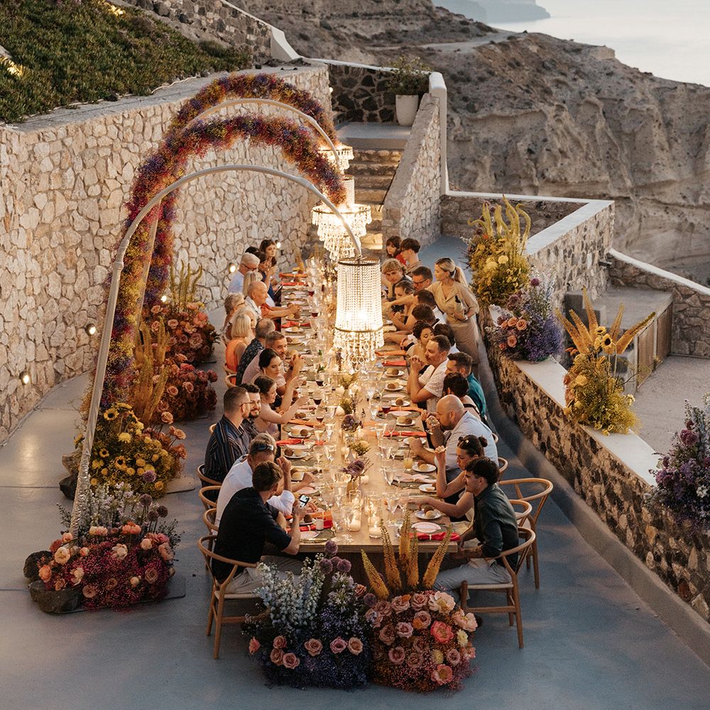 outdoor-wedding-breakfast-with-banquet-table-at-santorini-wedding
