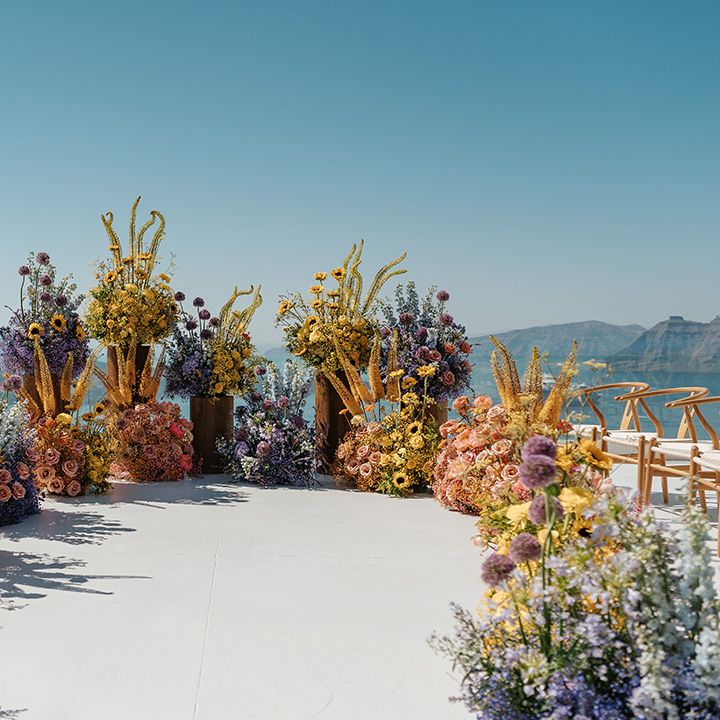 santorini-wedding-ceremony-with-colourful-wedding-flowers