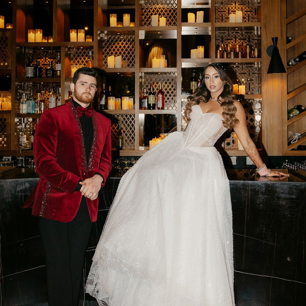 bride-in-galia-lahav-wedding-dress-with-groom-in-red-velvet-tuxedo