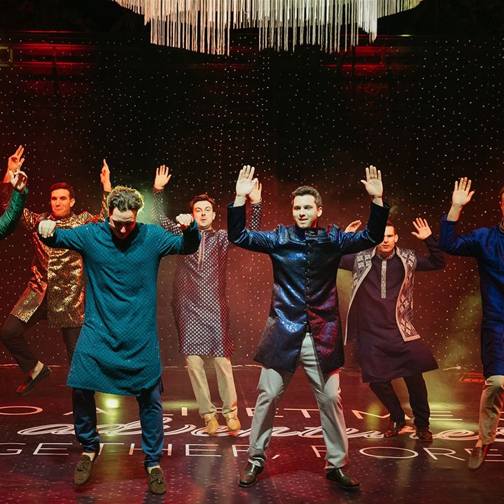 groom-and-groomsmen-dancing-on-stage