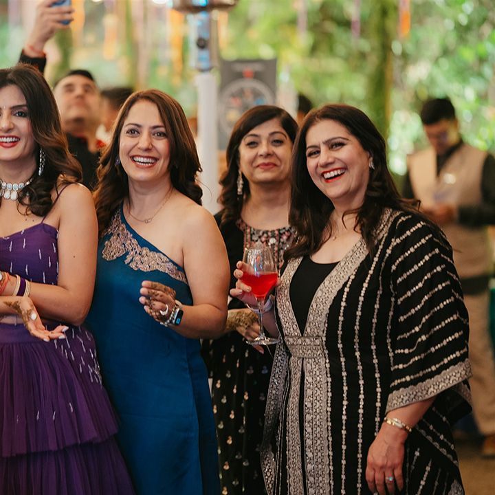 haldi-evening-wedding-celebrations-with-guests-enjoying-drinks