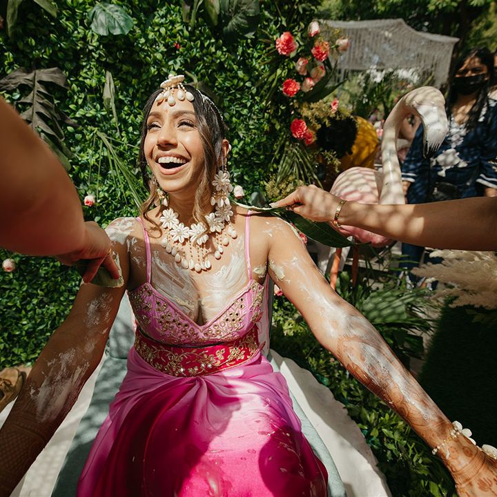 haldi-wedding-ceremony-with-bride-in-pink-dress