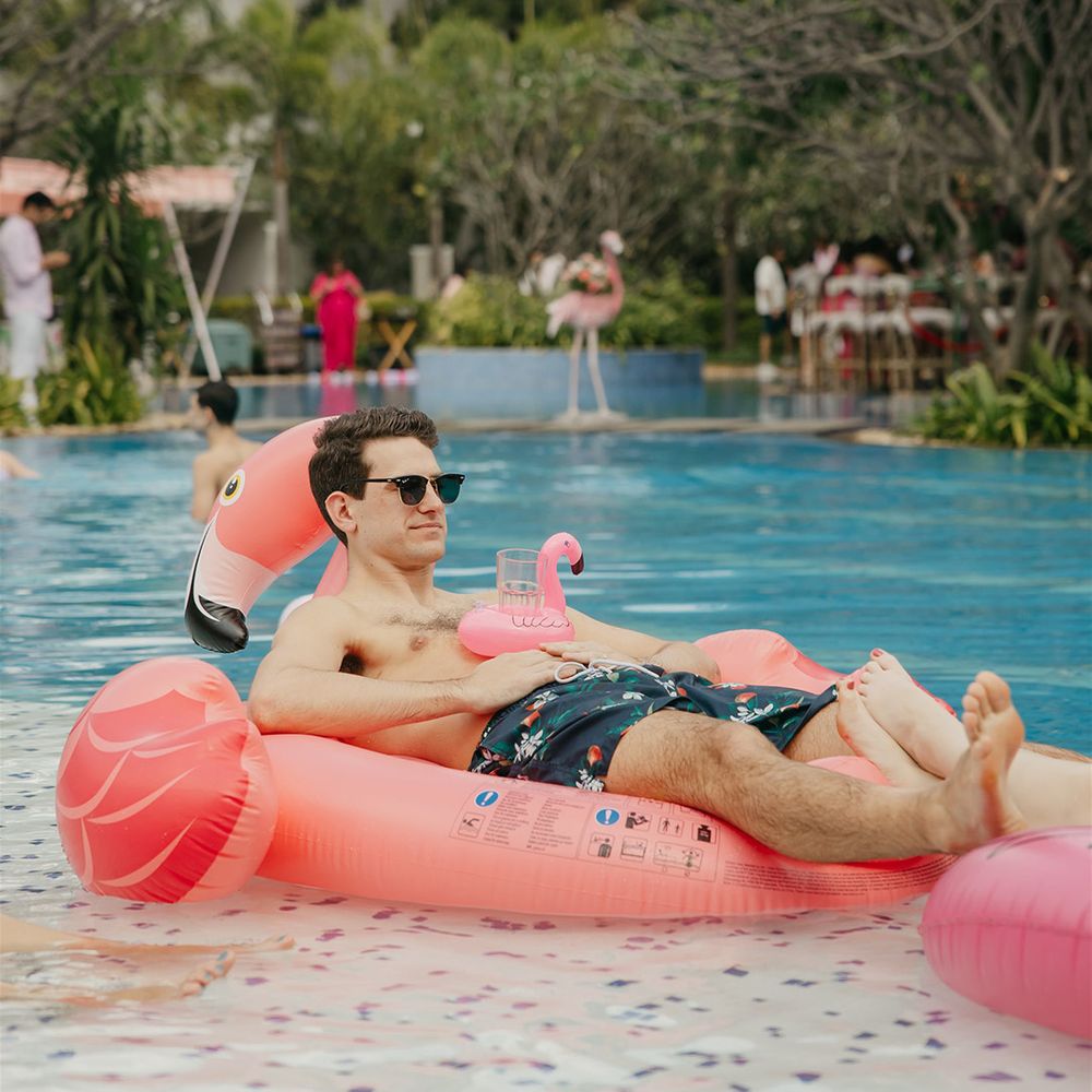 wedding-guest-on-flamingo-rubber-ring