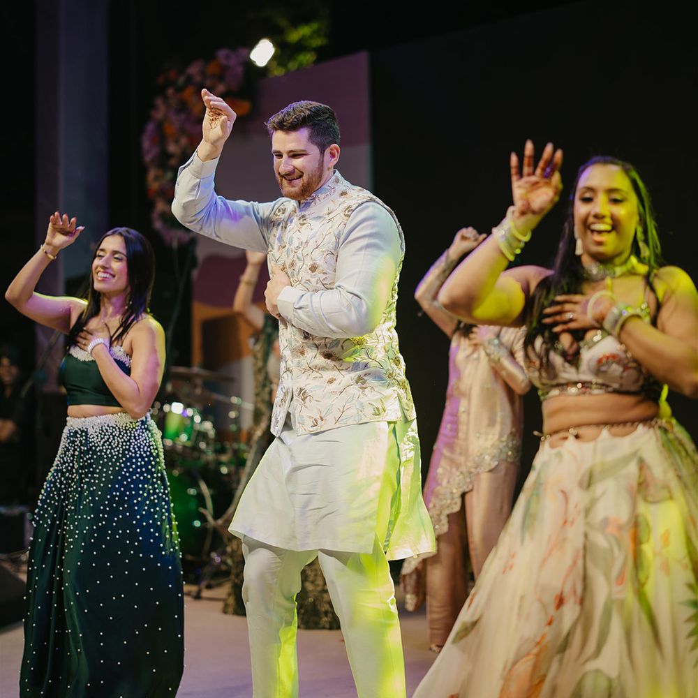 Wedding guests dancing on stage as part of the four-day wedding celebrations