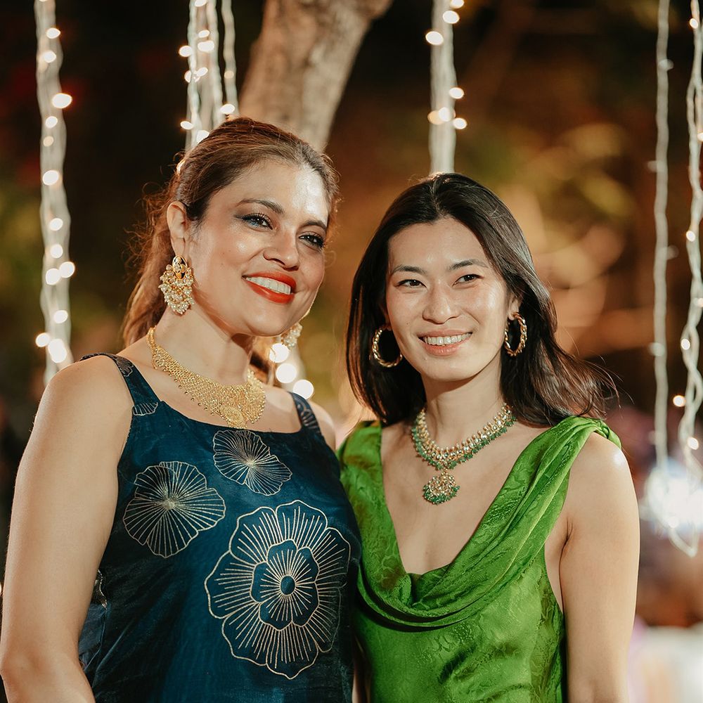 Wedding guests in green and blue dresses