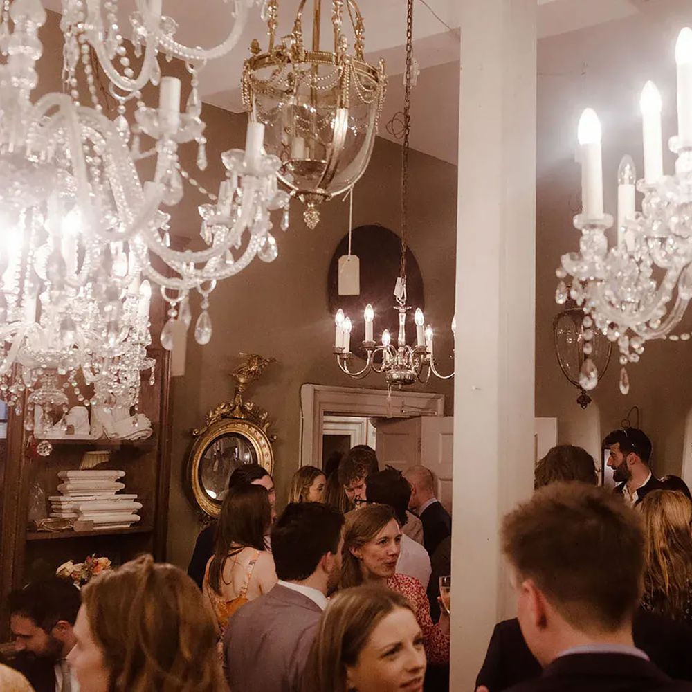 Brunswick House engagement party guests attending standing party