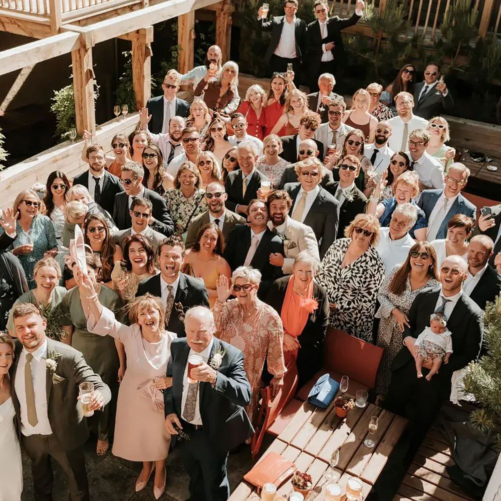 The George In engagement party venue with guests celebrating outdoors