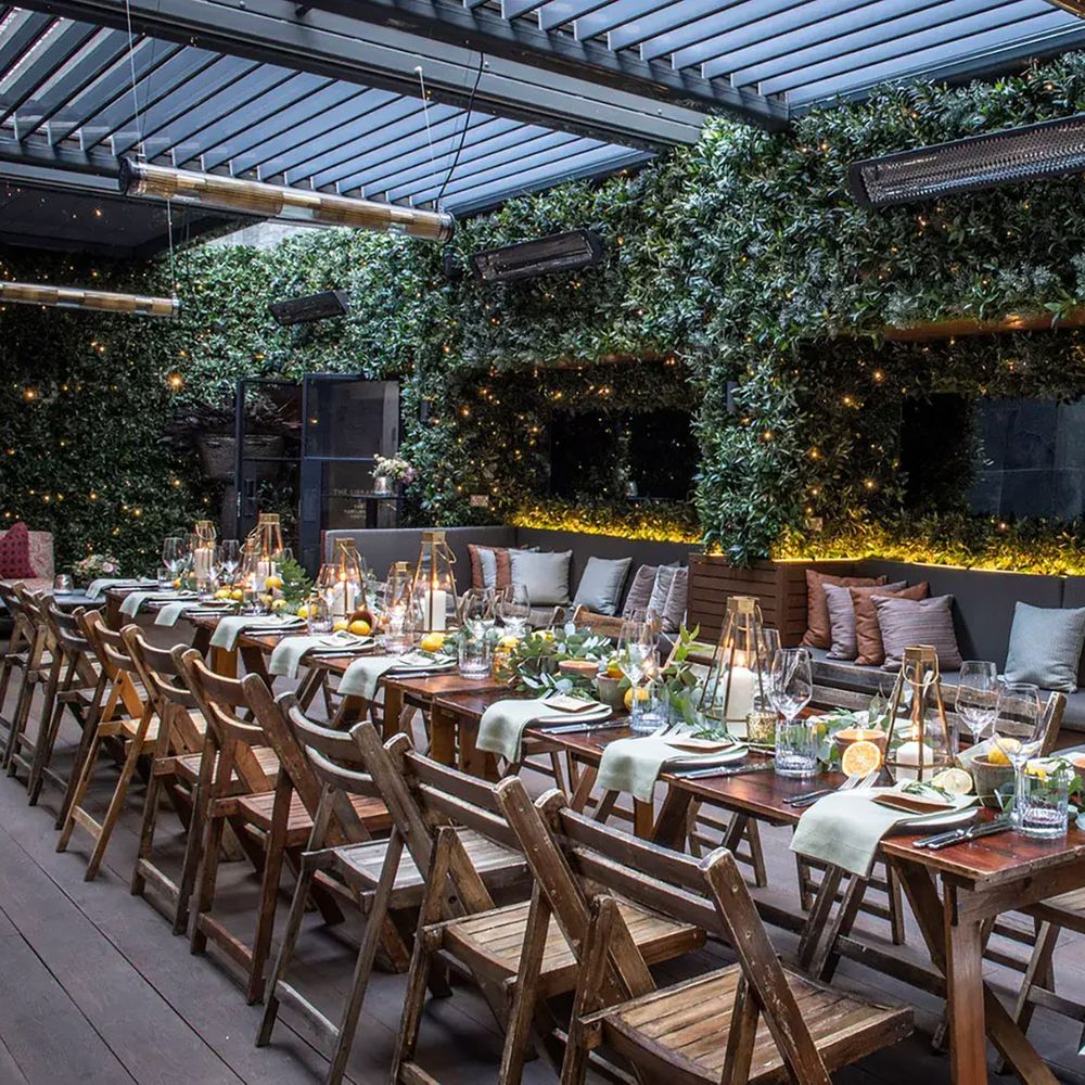 Outdoor engagement party table setting at The Marylebone Hotel courtyard