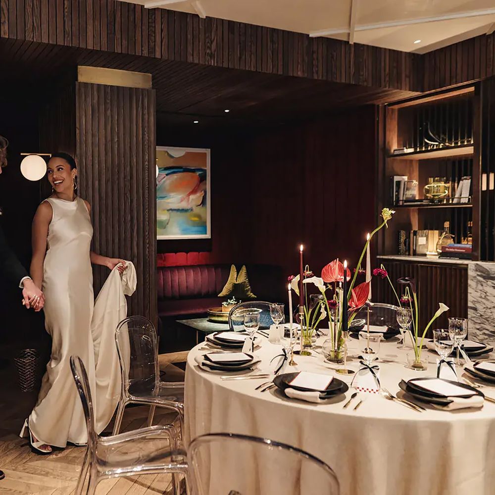 Couple making entrance at The Marylebone Hotel for engagement party event