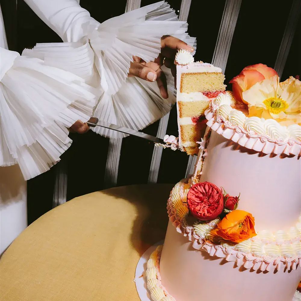 Bride cutting engagement party cake at The Standard Hotel 