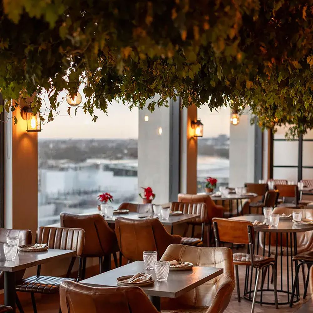 The Treehouse Hotel in London engagement party dining space with floor to ceiling windows