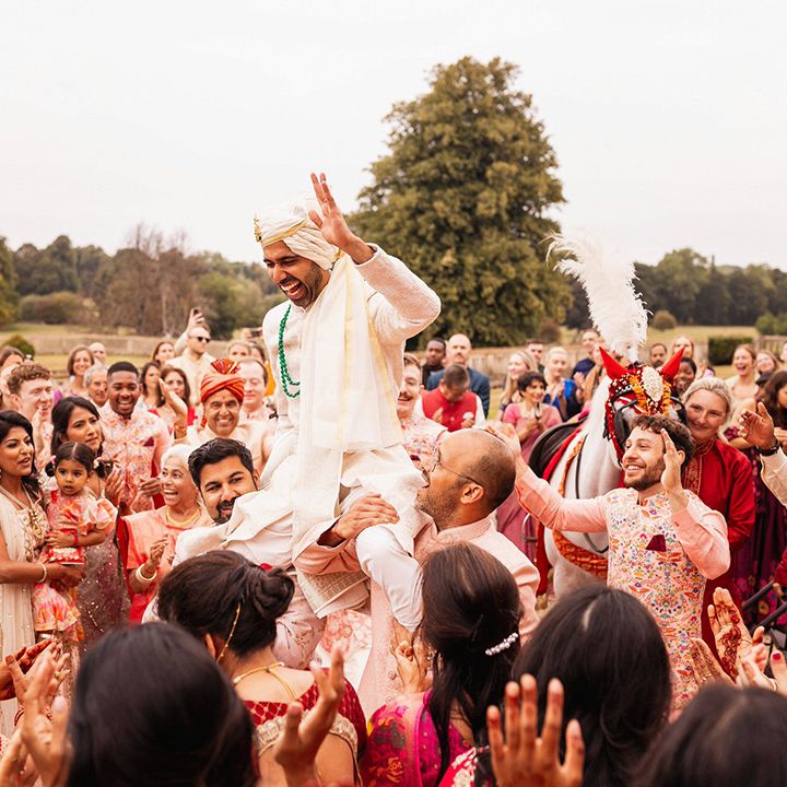 groom-lifted-into-the-air-for-wedding-entrance