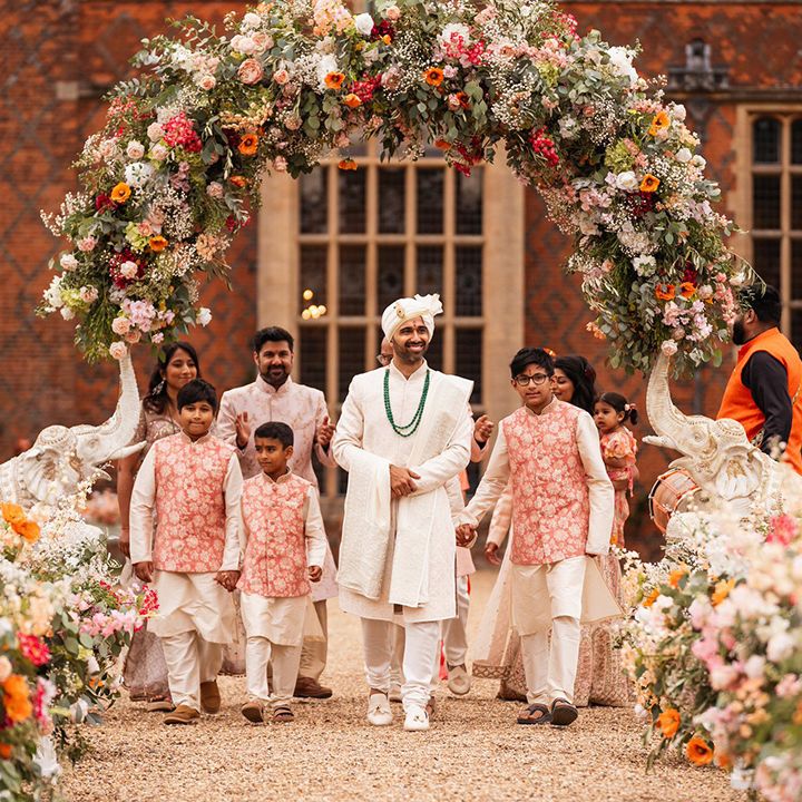 groom-walks-down-the-aisle-to-mandap