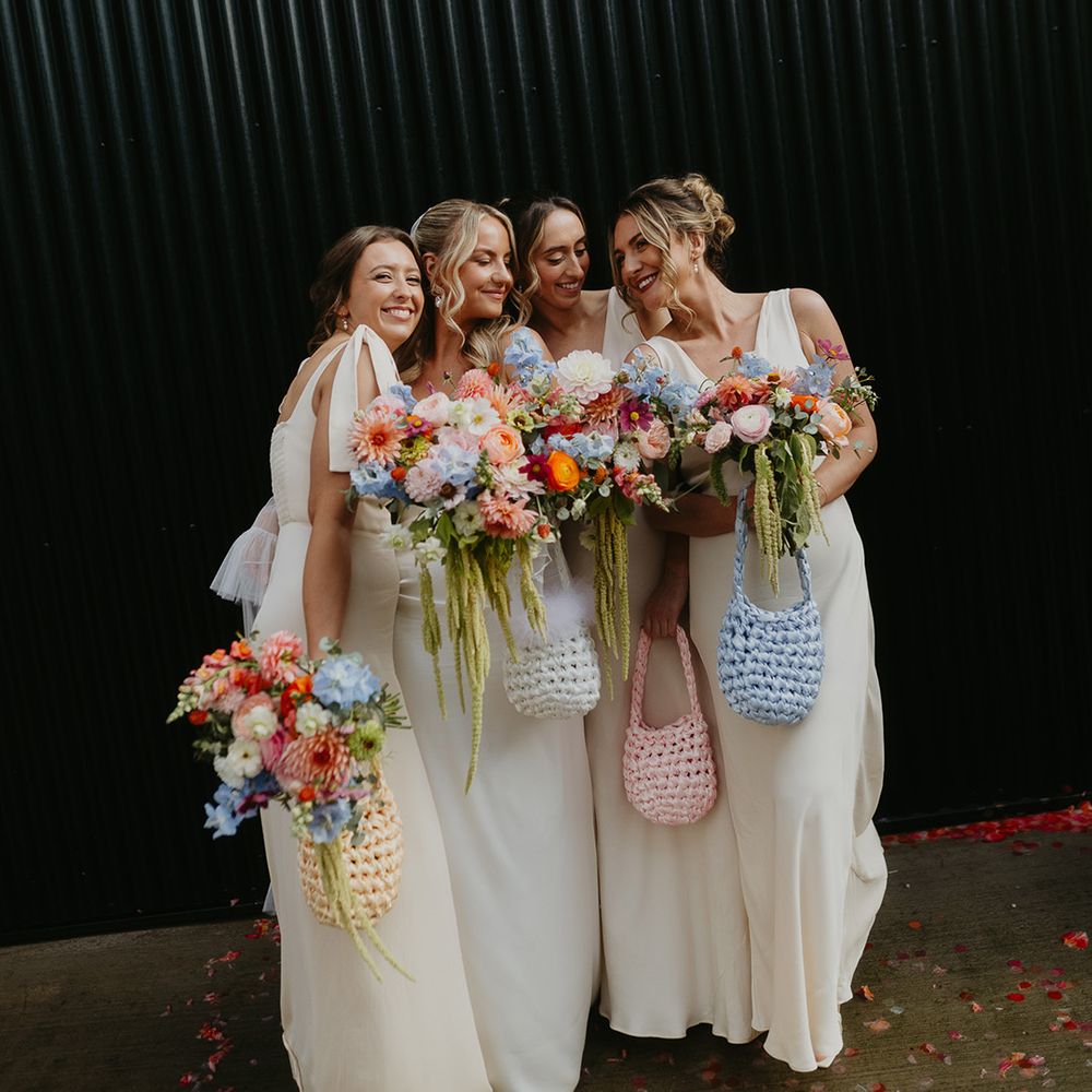 cream-bridesmaid-dresses-with-pastel-mismatched-bags