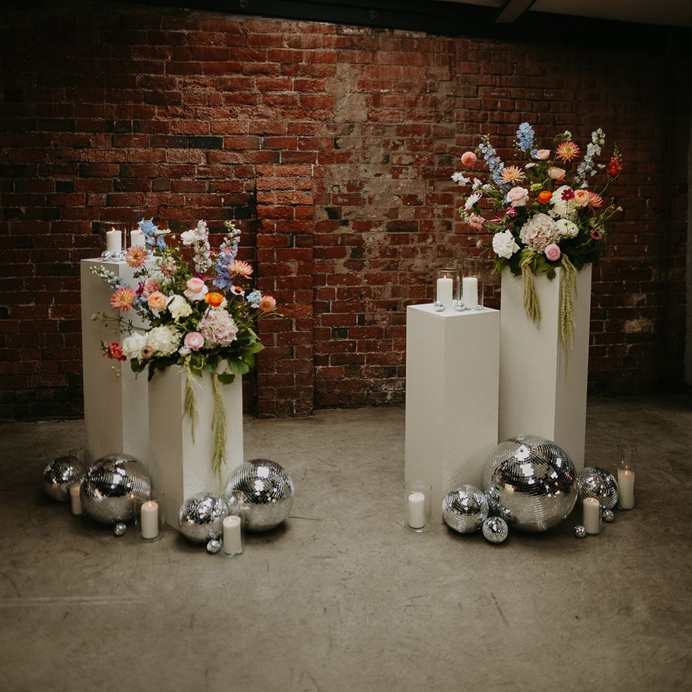 disco-balls-and-colourful-flowers-altar-decor.