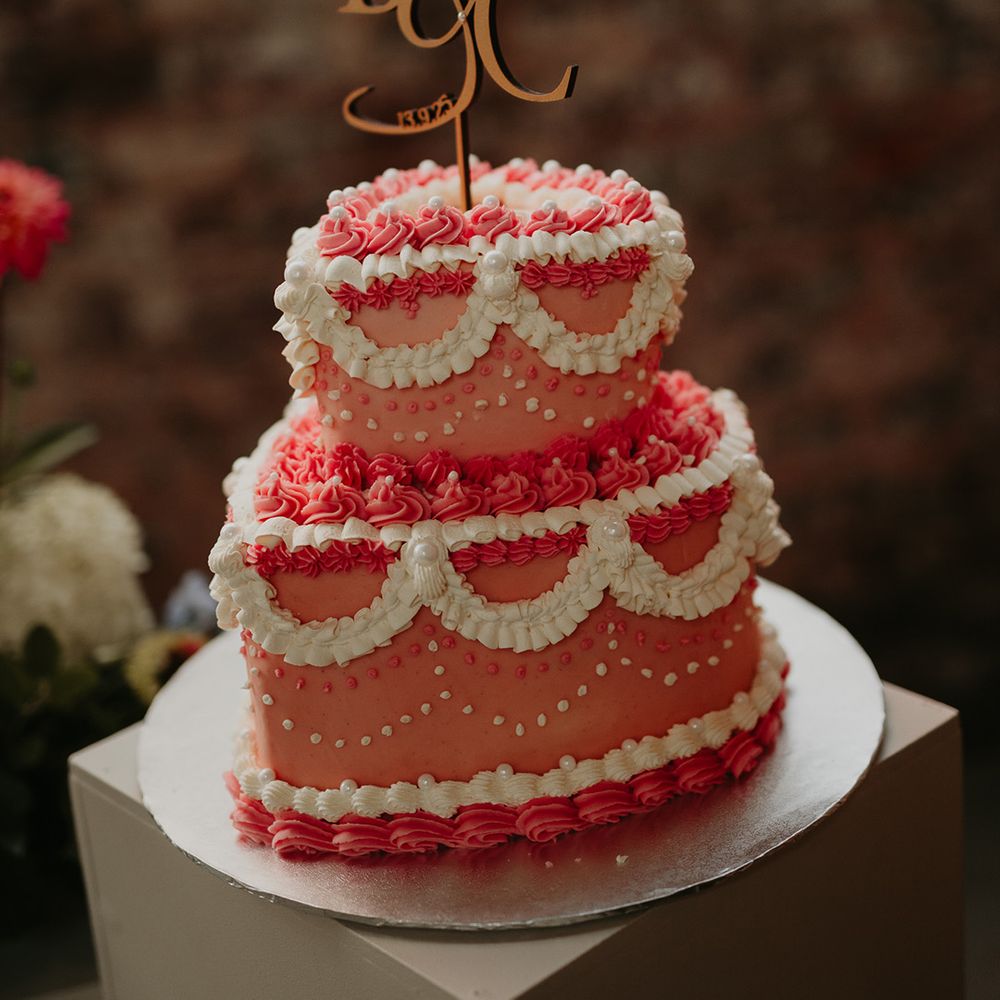 pink-heart-shaped-two-tier-wedding-cake-design-with-custom-cake-topper.