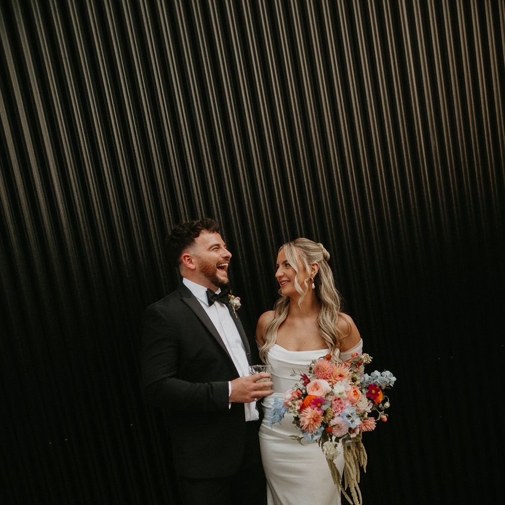 smiling-couple-portrait-at-modern-chic-shack-revolution-wedding