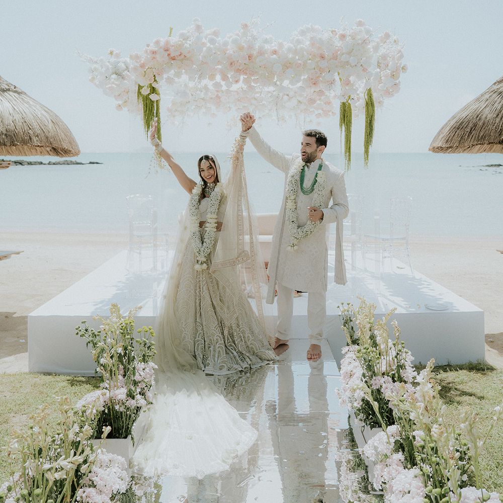 bride-and-groom-celebrate-as-they-face-guests-as-married-couple