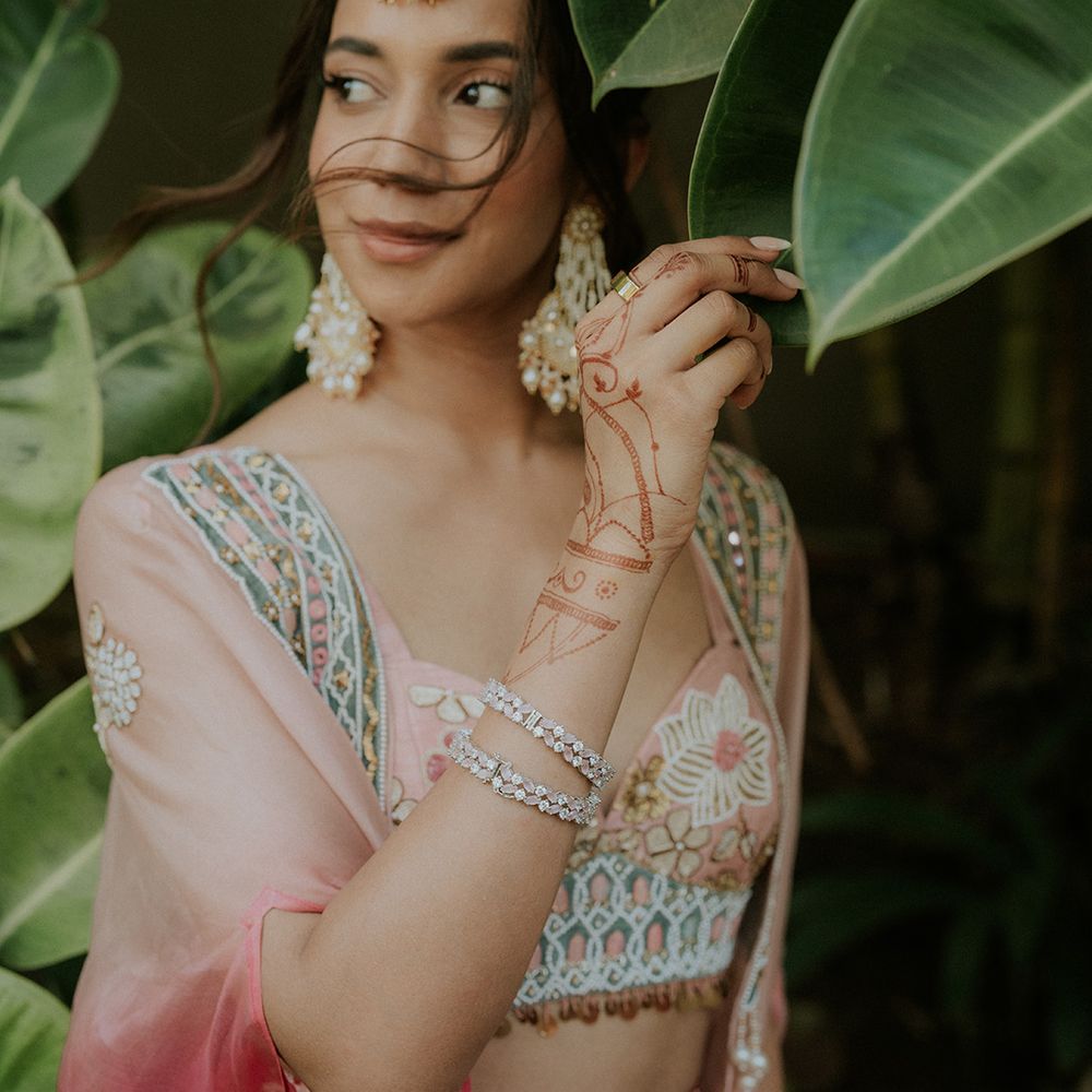 bride-in-pink-and-gold-outfit-for-haldi-ceremony