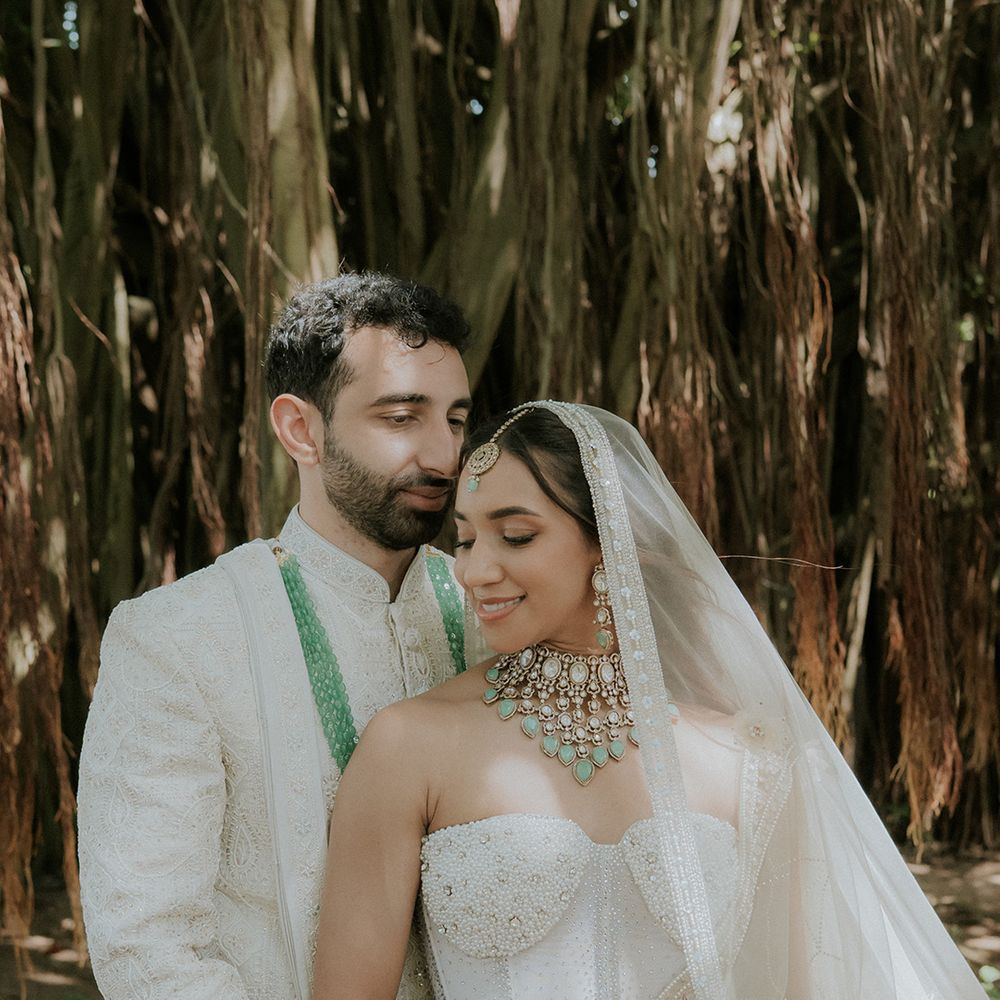 groom-embraces-bride-from-behind-at-mauritius-wedding