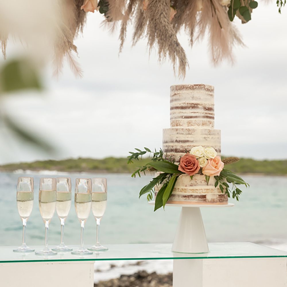 Sandals Resorts Caribbean destination wedding cake and champagne glasses