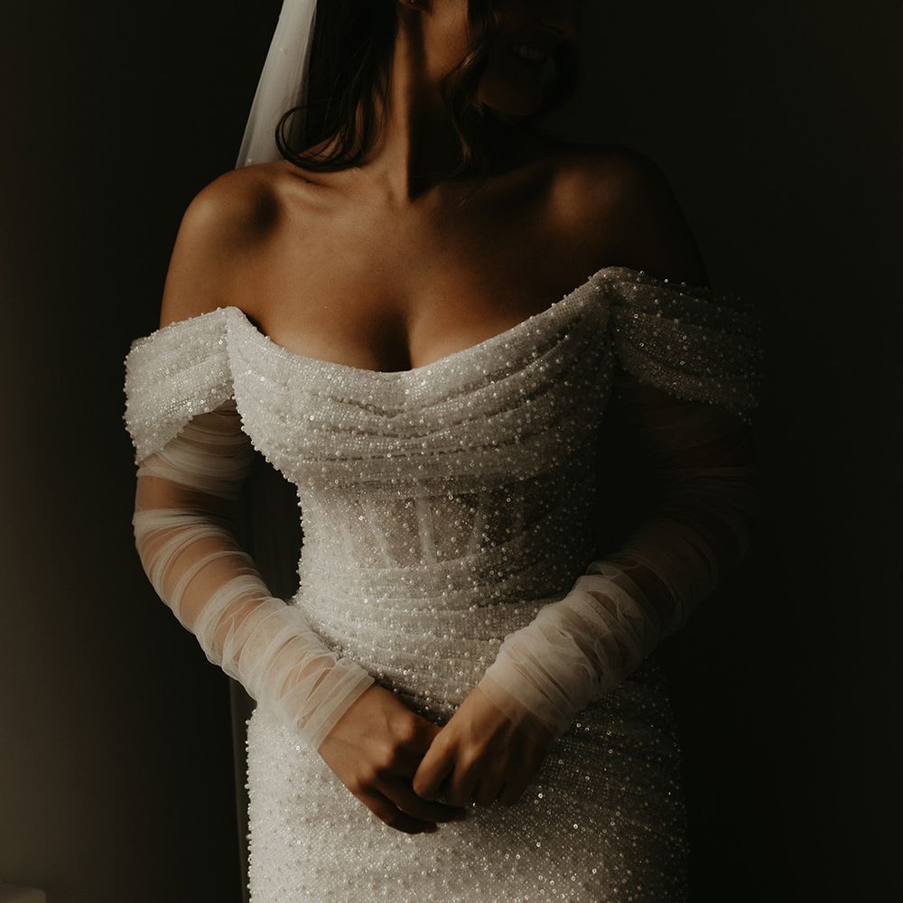 bride-in-pearl-beaded-wedding-dress-off-the-shoulder