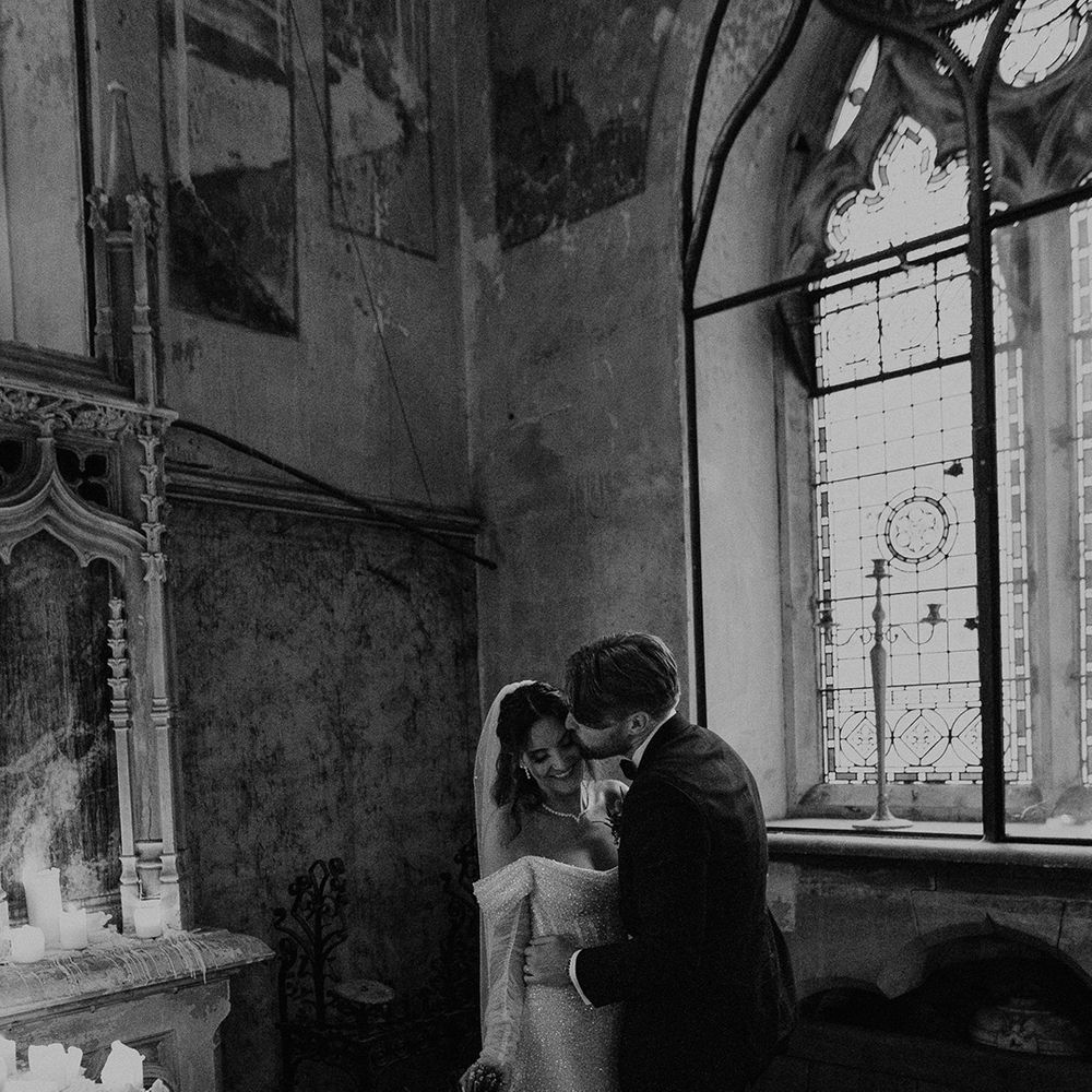 groom-kisses-bride-on-cheek