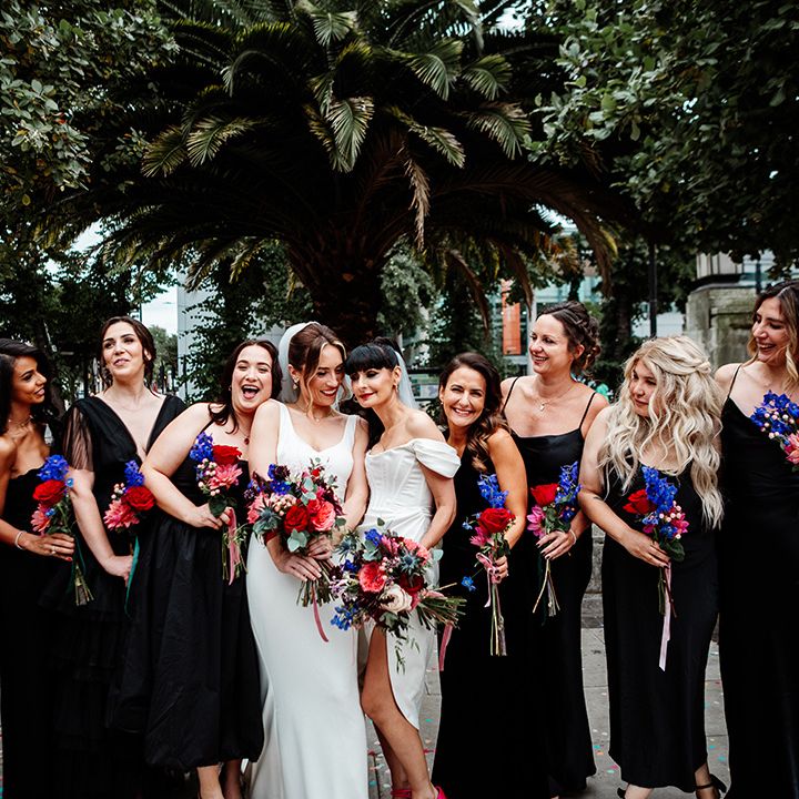 bridal-party-with-black-bridesmaid-dresses-and-colourful-bouquets